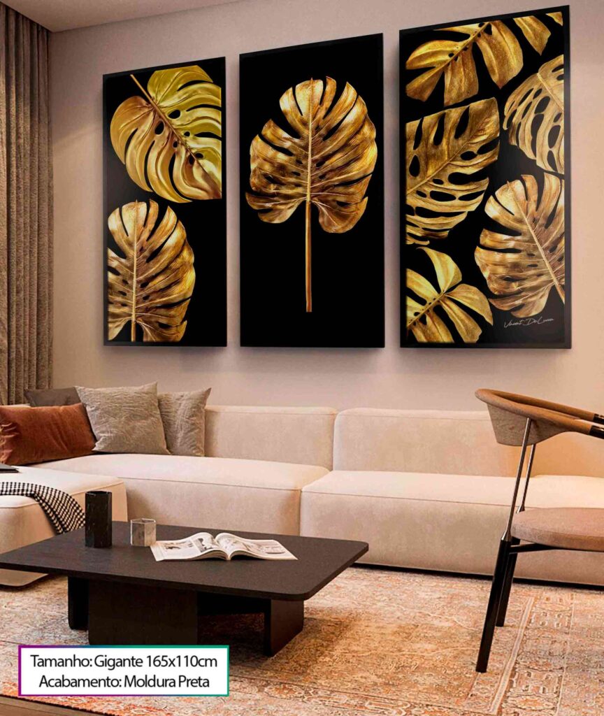 uma sala de estar com sofá branco e um quadro decorativo de 3 peças preto com folhas douradas em sua arte